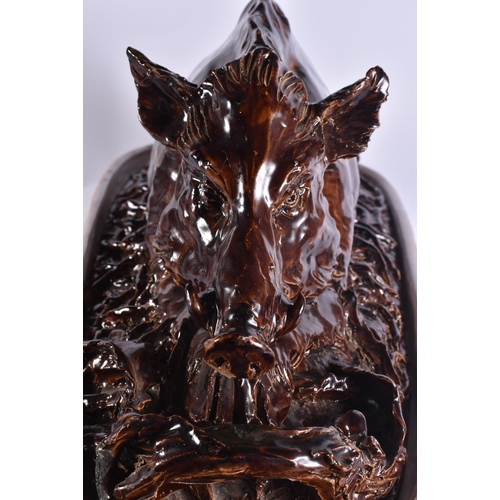 20G - A RARE LARGE 19TH CENTURY CONTINENTAL TREACLE GLAZED GAME TUREEN AND COVER formed with a large wild ... 