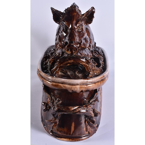 20G - A RARE LARGE 19TH CENTURY CONTINENTAL TREACLE GLAZED GAME TUREEN AND COVER formed with a large wild ... 