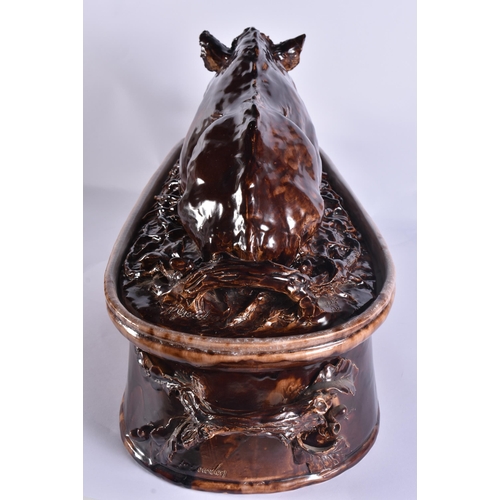 20G - A RARE LARGE 19TH CENTURY CONTINENTAL TREACLE GLAZED GAME TUREEN AND COVER formed with a large wild ... 