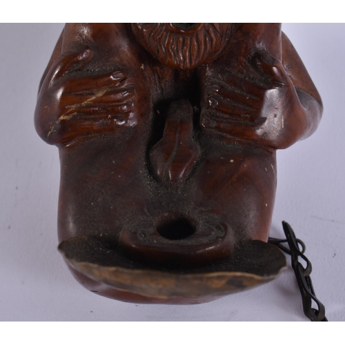 21 - A RARE EARLY 20TH CENTURY EROTIC CARVED WOOD TREEN HANGING OIL BURNER. 15 cm x 8 cm.