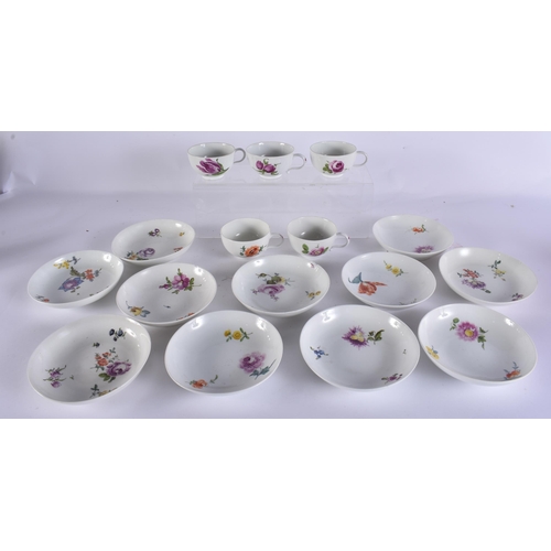 220C - A GROUP OF 19TH CENTURY MEISSEN CUPS AND SAUCER painted with botanical sprays. 13 cm wide. (16)