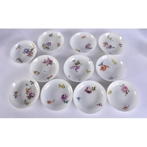 220C - A GROUP OF 19TH CENTURY MEISSEN CUPS AND SAUCER painted with botanical sprays. 13 cm wide. (16)