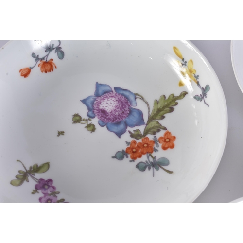 220C - A GROUP OF 19TH CENTURY MEISSEN CUPS AND SAUCER painted with botanical sprays. 13 cm wide. (16)