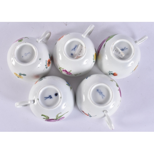 220C - A GROUP OF 19TH CENTURY MEISSEN CUPS AND SAUCER painted with botanical sprays. 13 cm wide. (16)
