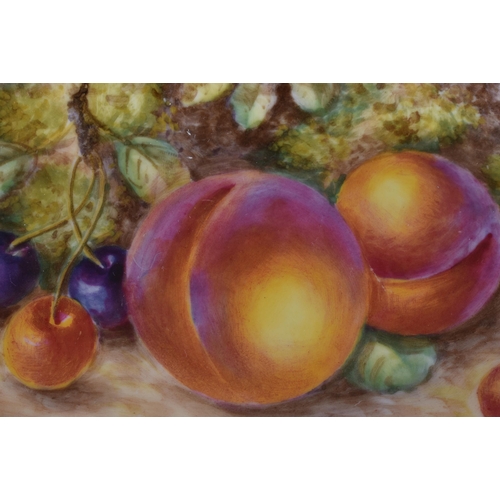 230 - A ROYAL WORCESTER FRUIT PAINTED PORCELAIN DISH by Freeman. 17 cm wide.