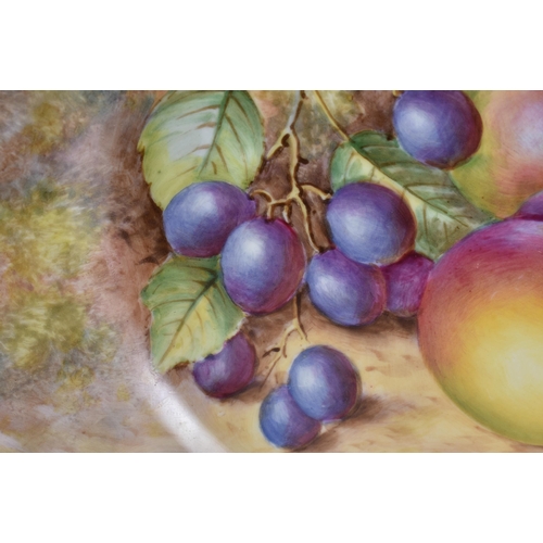 234 - A ROYAL WORCESTER FRUIT PAINTED PORCELAIN PLATE by Freeman. 27 cm wide.