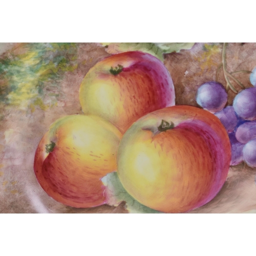 238 - A ROYAL WORCESTER FRUIT PAINTED PORCELAIN PLATE by Johnson. 24 cm wide.