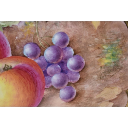 238 - A ROYAL WORCESTER FRUIT PAINTED PORCELAIN PLATE by Johnson. 24 cm wide.