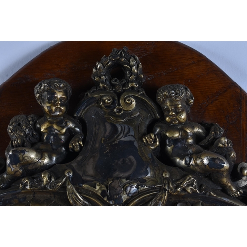 24 - A LARGE 18TH/19TH CENTURY GRAND TOUR PARTIAL GILDED REPOUSSE PLAQUE upon a later oak shield. 54 cm x... 