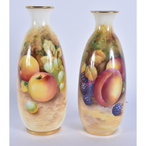 244 - A PAIR OF ROYAL WORCESTER FRUIT PAINTED PORCELAIN VASES. 15 cm high.