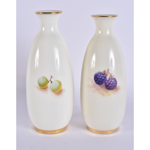244 - A PAIR OF ROYAL WORCESTER FRUIT PAINTED PORCELAIN VASES. 15 cm high.