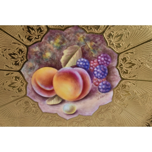 250 - A PAIR OF ROYAL WORCESTER FRUIT PAINTED PORCELAIN PLATES by Reed. 25 cm wide.