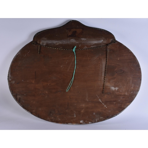 26 - A LARGE ARTS AND CRAFTS BRASS MIRROR overlaid with berries and vines. 86 cm x 68 cm.