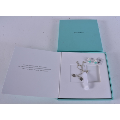 265 - A TIFFANY & CO SILVER NECKLACE together with a pair of tiffany silver earrings. (3)