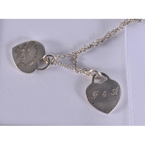 265 - A TIFFANY & CO SILVER NECKLACE together with a pair of tiffany silver earrings. (3)