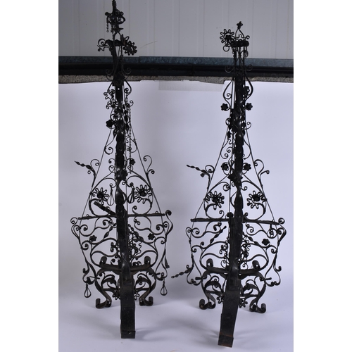 27 - A LARGE AND UNUSUAL PAIR OF ARTS AND CRAFTS FIRESIDE ANDIRONS. 95 cm x 25 cm.
