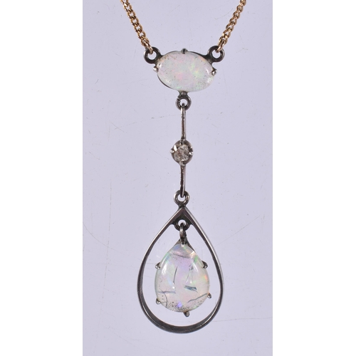 282 - AN EDWARDIAN 9CT GOLD AND OPAL NECKLACE. 3.3 grams. 42 cm long, pendant 3.75 cm x 1.25 cm.