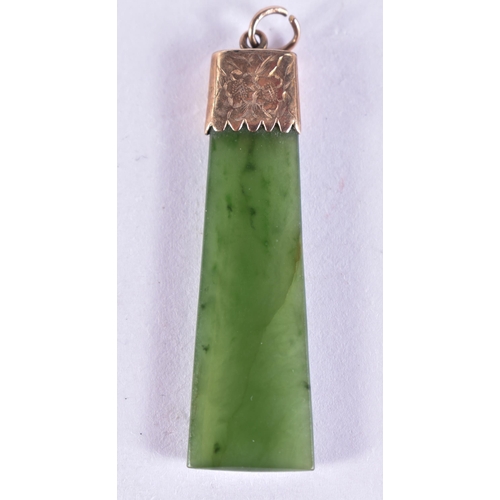 283 - A 9CT GOLD MOUNTED JADE PENDANT. 5 grams. 4.75 cm x 1.25 cm.