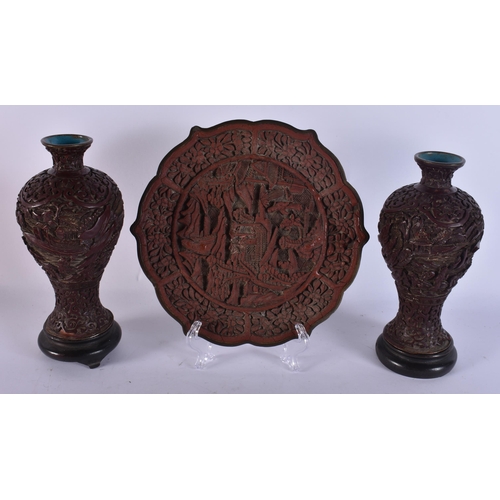 287 - A 19TH CENTURY CHINESE CINNABAR LACQUER DISH together with a pair of vases. (3)