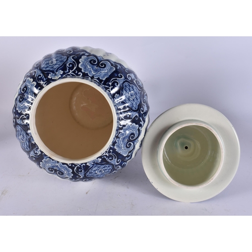 317A - A DUTCH DELFT BLUE AND WHITE POTTERY VASE AND COVER. 39 cm high.