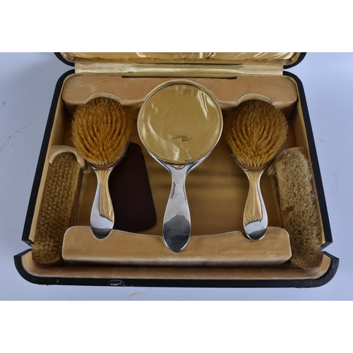 33 - AN ANTIQUE SILVER AND TORTOISESHELL DRESSING TABLE SET. 750 grams overall. Box 42 cm x 32 cm.