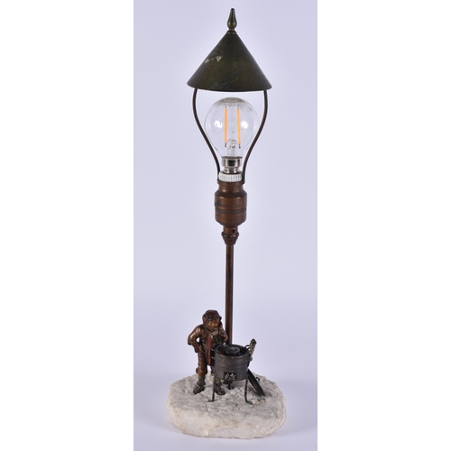 342 - AN EARLY 20TH CENTURY AUSTRIAN COLD PAINTED BRONZE LAMP formed as a boy beside a burning fire. 35 cm... 