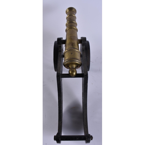 36 - AN ANTIQUE BRONZE AND CAST IRON CANNON. 45 cm wide.