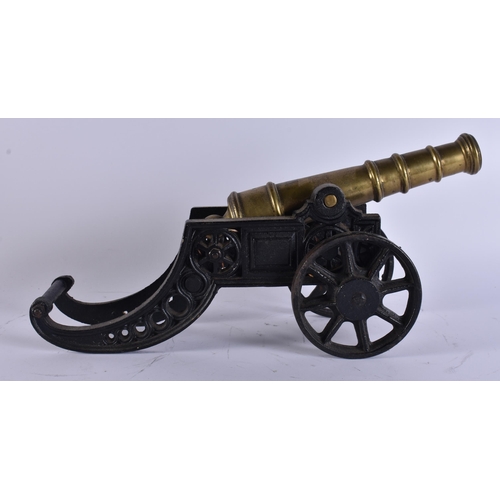 36 - AN ANTIQUE BRONZE AND CAST IRON CANNON. 45 cm wide.