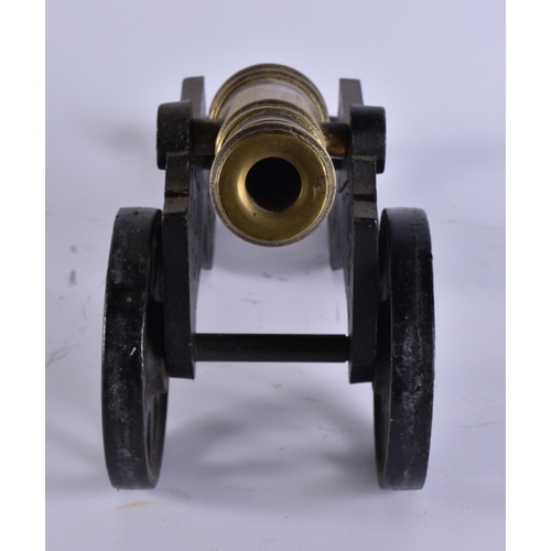 36 - AN ANTIQUE BRONZE AND CAST IRON CANNON. 45 cm wide.