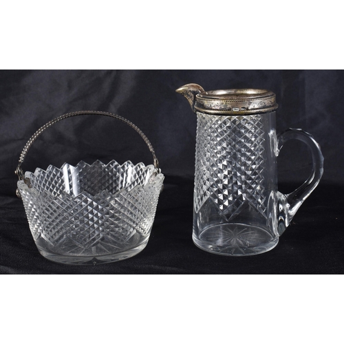 371 - AN ANTIQUE SILVER MOUNTED CUT GLASS BASKET and a matching jug. Largest 9 cm wide. (2)