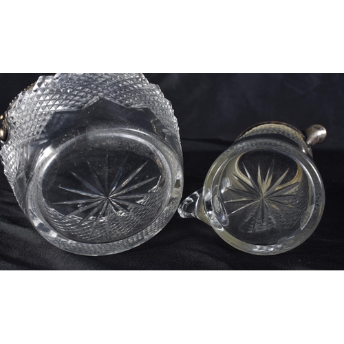 371 - AN ANTIQUE SILVER MOUNTED CUT GLASS BASKET and a matching jug. Largest 9 cm wide. (2)
