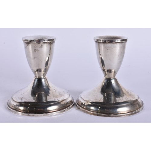 383 - A PAIR OF SILVER CANDLESTICKS. 360 grams overall. 9.5 cm high.
