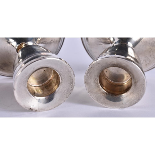 383 - A PAIR OF SILVER CANDLESTICKS. 360 grams overall. 9.5 cm high.