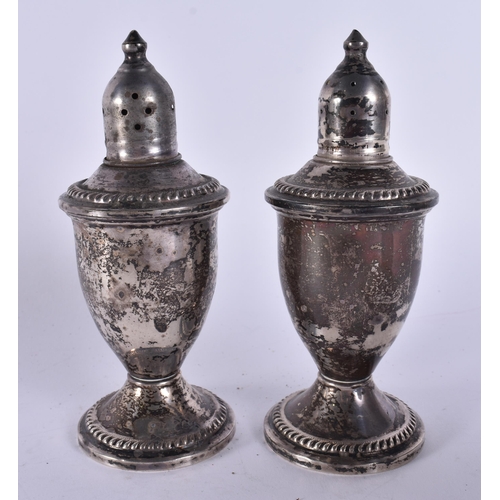 393 - A PAIR OF SILVER PEPPER POTS. 250 grams overall. 11 cm high.