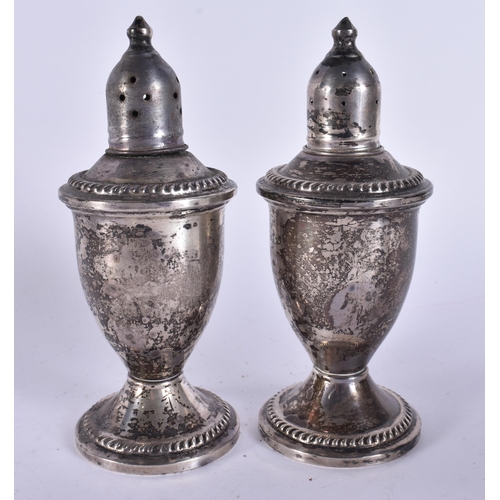 393 - A PAIR OF SILVER PEPPER POTS. 250 grams overall. 11 cm high.