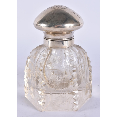 399 - A SILVER MOUNTED GLASS INKWELL. 16 cm high.