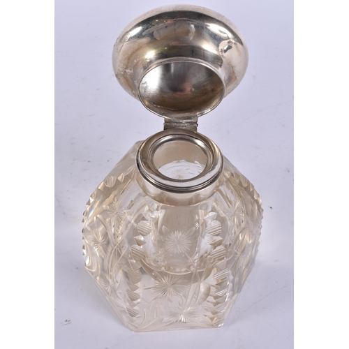 399 - A SILVER MOUNTED GLASS INKWELL. 16 cm high.