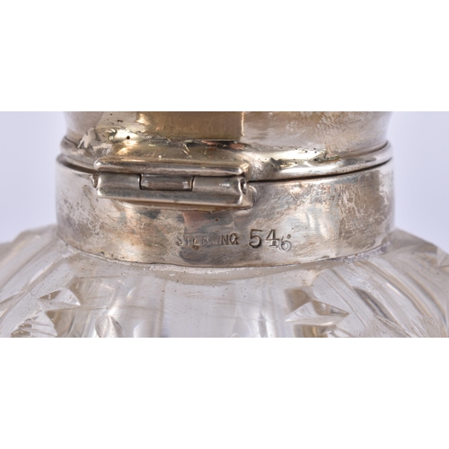 399 - A SILVER MOUNTED GLASS INKWELL. 16 cm high.