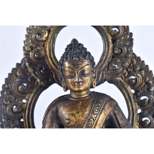 40D - AN 18TH/19TH CENTURY NEPALESE TIBETAN BRONZE BUDDHA modelled behind a flaming shrine. 22 cm x 10 cm.