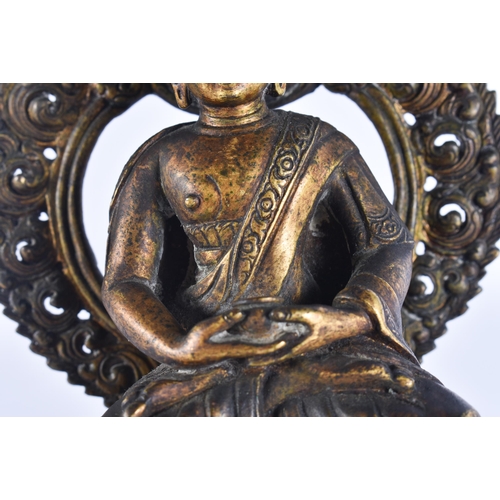 40D - AN 18TH/19TH CENTURY NEPALESE TIBETAN BRONZE BUDDHA modelled behind a flaming shrine. 22 cm x 10 cm.