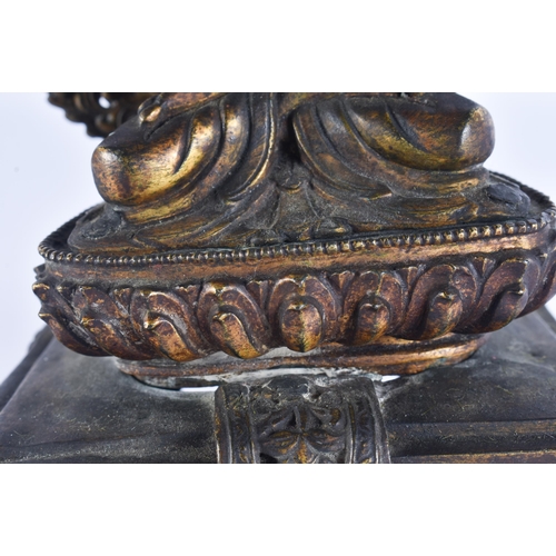 40D - AN 18TH/19TH CENTURY NEPALESE TIBETAN BRONZE BUDDHA modelled behind a flaming shrine. 22 cm x 10 cm.