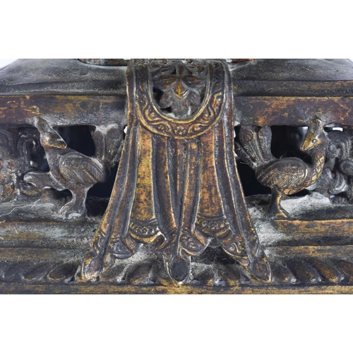 40D - AN 18TH/19TH CENTURY NEPALESE TIBETAN BRONZE BUDDHA modelled behind a flaming shrine. 22 cm x 10 cm.