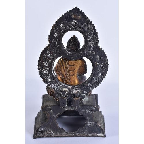 40D - AN 18TH/19TH CENTURY NEPALESE TIBETAN BRONZE BUDDHA modelled behind a flaming shrine. 22 cm x 10 cm.