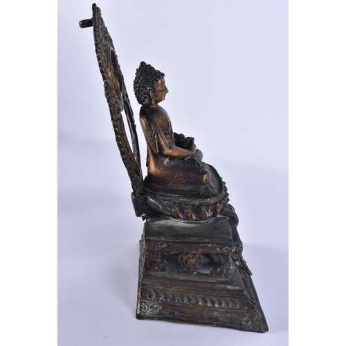 40D - AN 18TH/19TH CENTURY NEPALESE TIBETAN BRONZE BUDDHA modelled behind a flaming shrine. 22 cm x 10 cm.