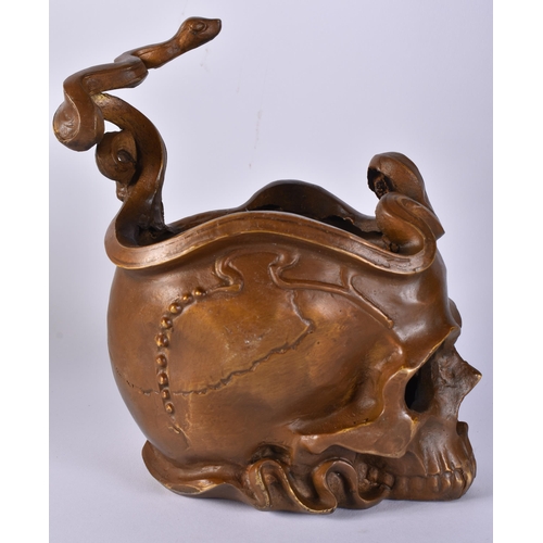 413 - A CONTINENTAL BRONZE SERPENT AND SKULL. 21 cm x 12 cm.