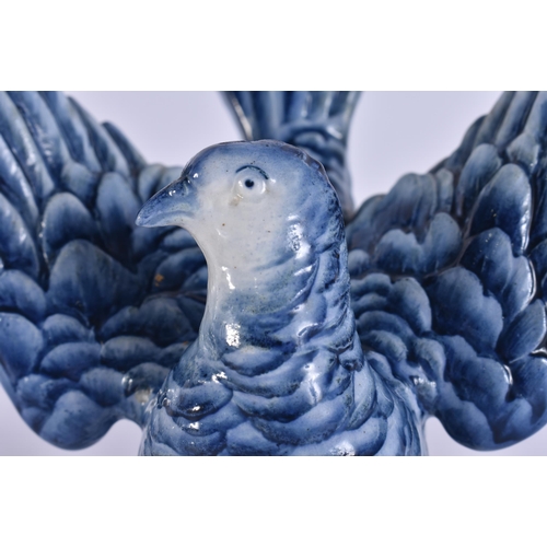 46 - AN EXTREMELY RARE 19TH CENTURY WEDGWOOD BLUE AND WHITE BIRD modelled upon a base smothered in leaves... 