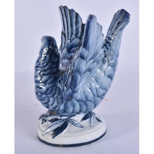 46 - AN EXTREMELY RARE 19TH CENTURY WEDGWOOD BLUE AND WHITE BIRD modelled upon a base smothered in leaves... 