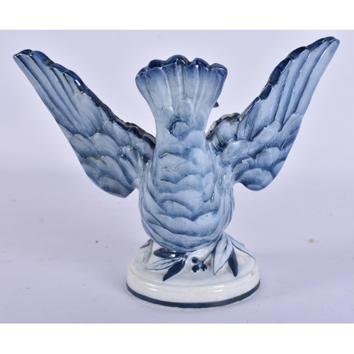 46 - AN EXTREMELY RARE 19TH CENTURY WEDGWOOD BLUE AND WHITE BIRD modelled upon a base smothered in leaves... 