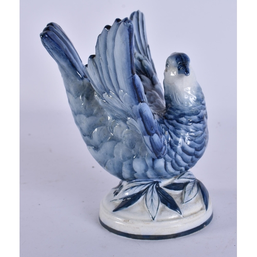 46 - AN EXTREMELY RARE 19TH CENTURY WEDGWOOD BLUE AND WHITE BIRD modelled upon a base smothered in leaves... 