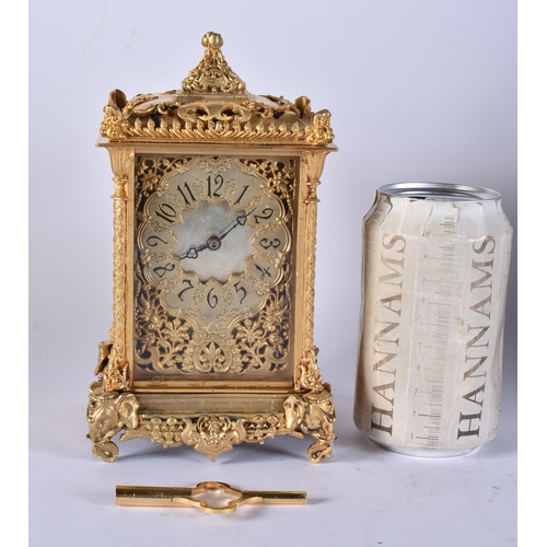 467 - A BRONZE RETICULATED CARRIAGE CLOCK. 19 cm high.